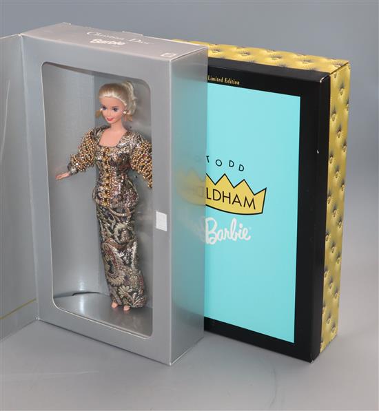 Four Barbie dolls: Christian Dior, Cynthia Rowley, Todd Oldham and Armani